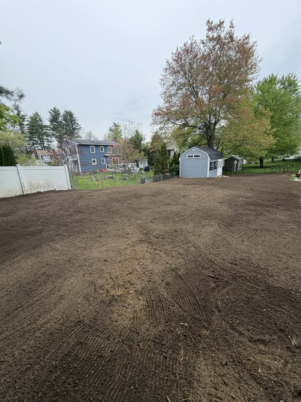 Backyard leveled and graded after cleanup