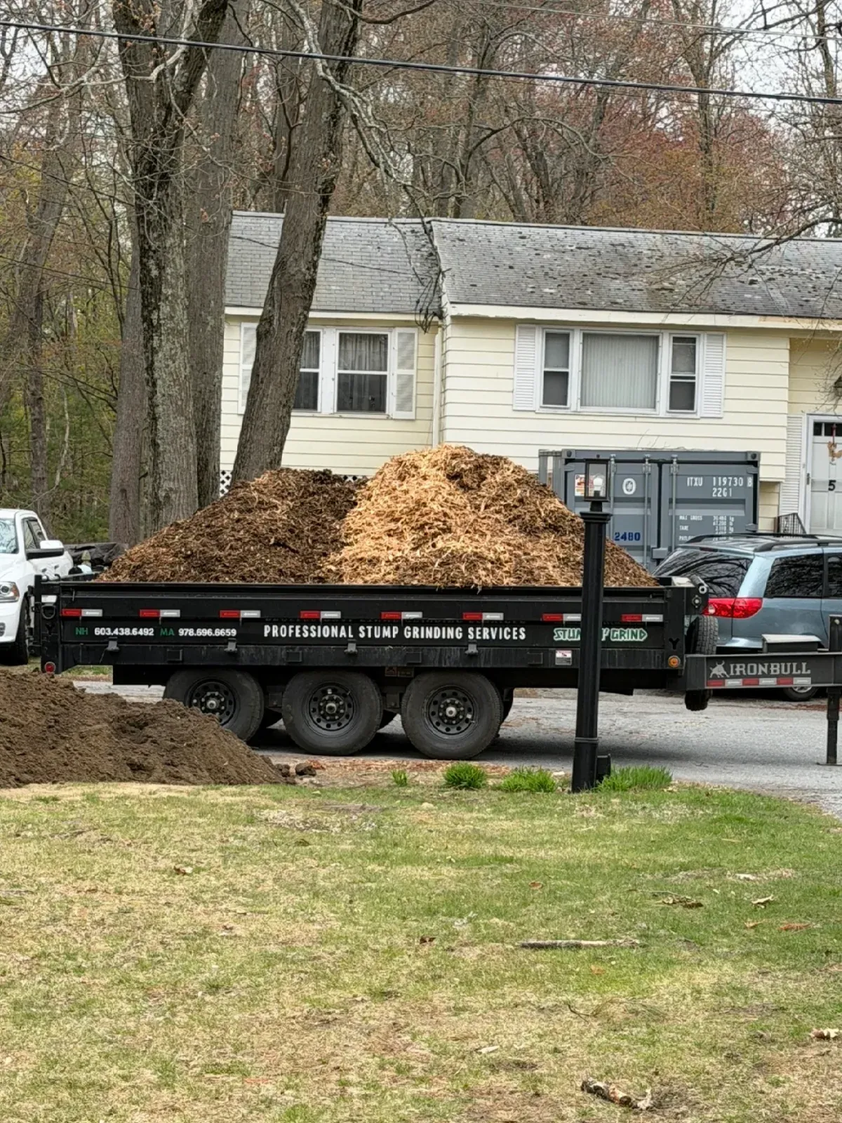 Trailer loaded with stump grindings ready to haul away